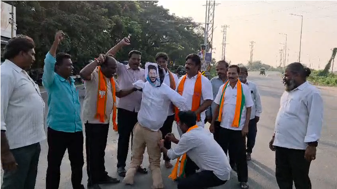 BJP leaders and activists protesting against Chief Minister Revanth Reddy at Bridge Center in Bhadrachalam